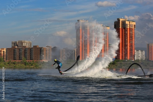 Flyboarding is an extreme water sport and entertainment that allows a person to float in the air above the water using a powerful water flow.