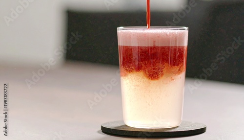 Fotografi Refreshing Strawberry and Soda Drink Being Poured