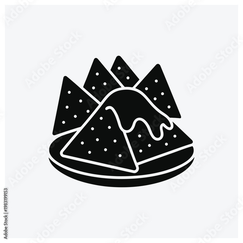 Silhouette of nachos with cheese on a plate.