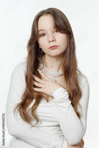 Portrait of a beautiful young girl wearing pearl jewelry
