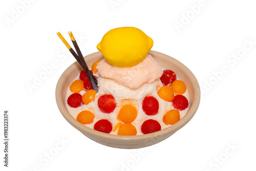 A refreshing bowl of fruit bingsu featuring shaved ice, melon and watermelon scoops, topped with a lemon-shaped dessert and Pocky.