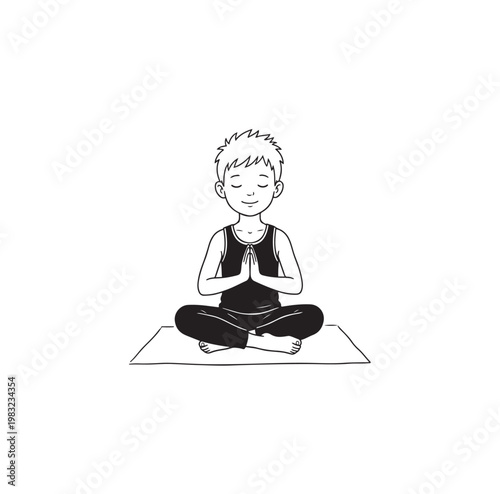 Young boy meditating in lotus pose on yoga mat.
