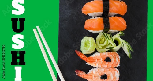 Sushi text with sushi and chopsticks in a plate on black surface