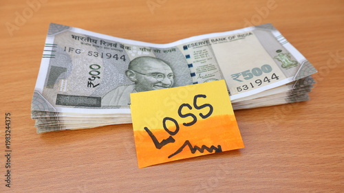 Financial Loss concept with Indian Rupee notes