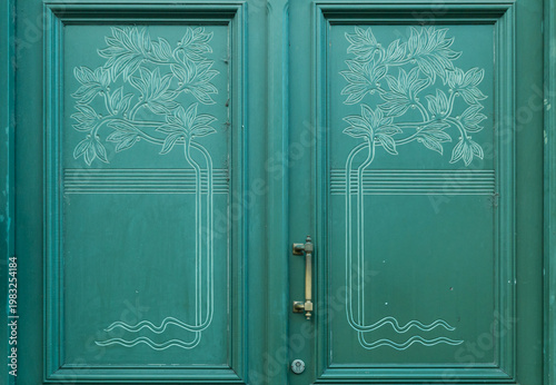 Elegant Dark Green Wooden Door with Art Nouveau Floral Engravings