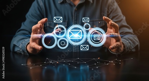 Man holding glowing email and gear icons representing digital communication and automation.