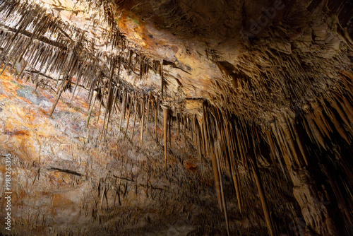 Photos Dark mysterious cave with stalactites and stalagmites underground scene