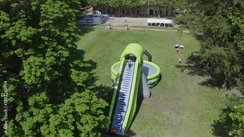 Aerial View of Inflatable Slide and Airbag Jump Attraction in Park
