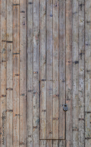 Wooden rustic wall with vertical planks and hidden door detail