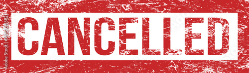 The word 'CANCELLED' is imprinted in bold white letters on a rough, red rubber stamp against white.