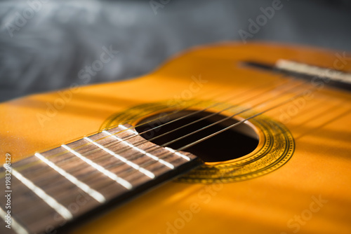 Guitar Body And Strings In Sunlight. Acoustic Musical Instrument. Music Background. Shallow Depth Of Field