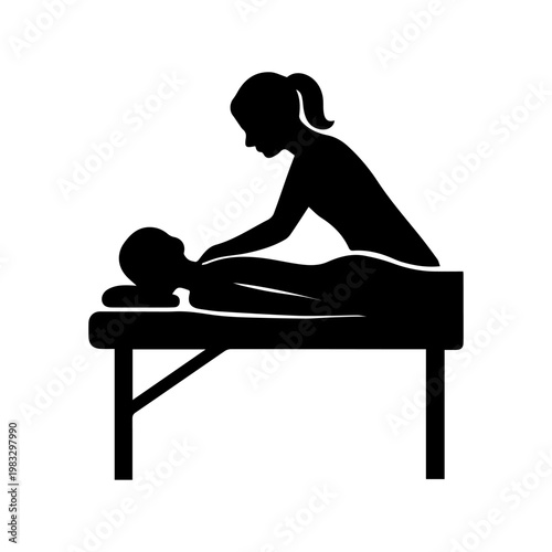 Therapist giving massage to person lying on table