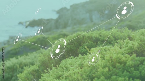 Single node appearing, 3D network expanding and linking icons over coastal shrubs, showing growth