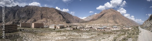 Abandoned buildings in a barren landscape, ghost town of Enilchek in the Tien Shan Mountains, Ak-Su, Kyrgyzstan