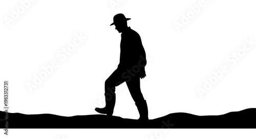 Silhouette of a man wearing a hat and boots, walking on an uneven ground against a white background.