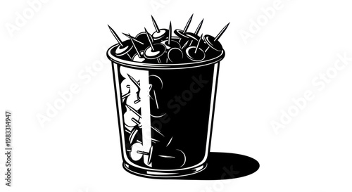 Black cup filled with sewing pins.