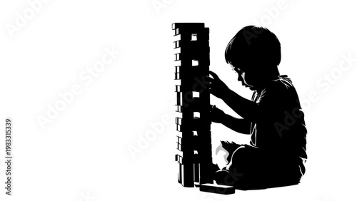 Silhouette of child playing blocks.