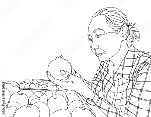 continuous line art of a woman in a plaid shirt carefully examining a fresh fruit at a grocery market stall.