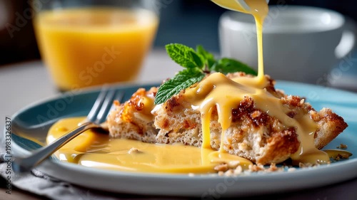 Crispy toast dessert topped with creamy orange sauce and mint on a blue plate