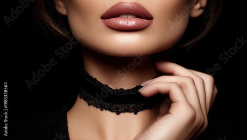 A close-up detail of a hand gripping a choker in warm sepia tones
