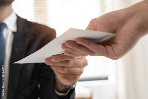 фотографія Close up view of office worker receiving salary from boss.