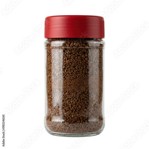Brown instant coffee granules in transparent glass jar with bright red lid, studio shot on clean white background.