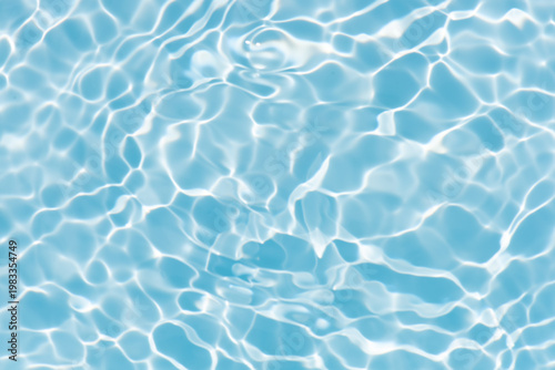 Blue water with ripples on the surface. Defocus blurred transparent blue colored clear calm water surface texture with splashes and bubbles. Water waves with shining pattern texture background.