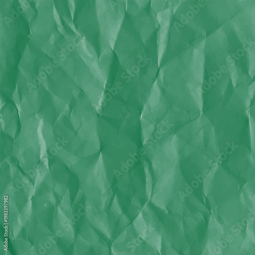 A close up view of intensely crumpled textured green paper with varying light and shadow