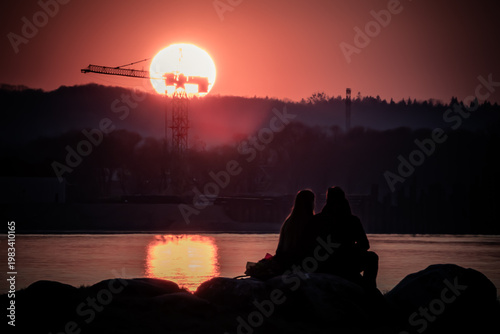 silhouette of a man sitting on a bench