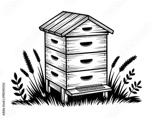 Black and white of a stacked beehive in tall grass apiary beekeeping nature