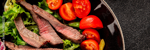beef steak slices and french fries, vegetables meat salad tasty snack fresh, delicious, gourmet food background on the table rustic food top view copy space
