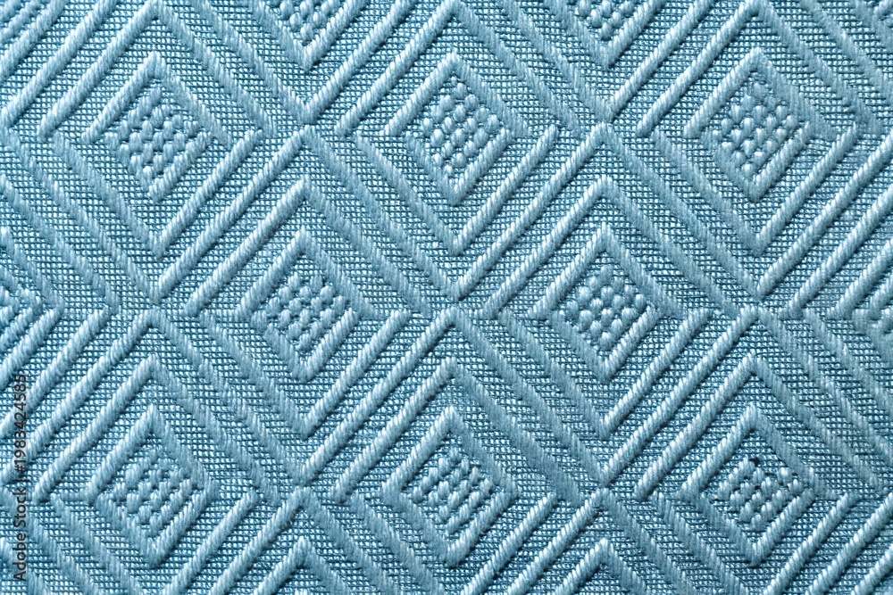 Fototapeta premium Natural Light Blue Embossed Geometric Diamond Pattern Fabric Texture Background