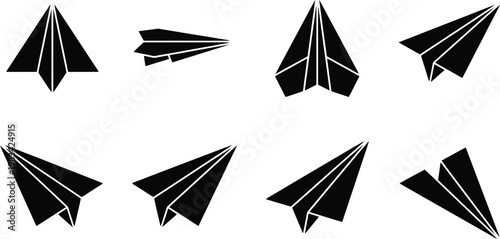 Collection of Black Paper Airplanes in Various Orientations and Angles on White Background origami flight