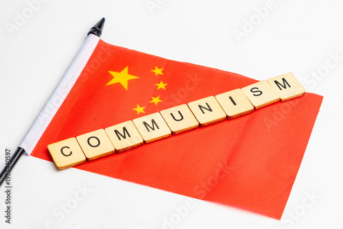 The flag of China with Communism spelt across it