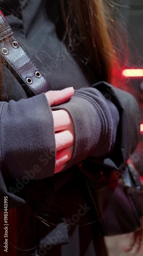 Close-Up of Hands Tucking into Clothing for Warmth from Cold