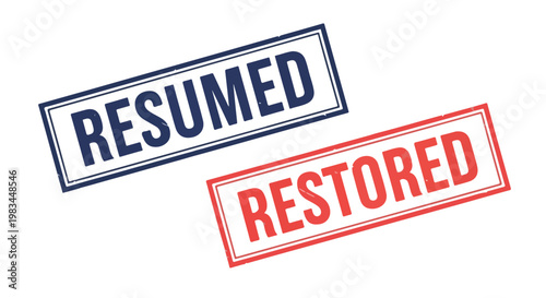 Close-up of two rubber stamps with the words resumed and restored in bold red and blue ink on white background