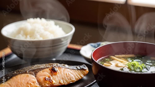 Delicious freshly made Japanese meal featuring grilled fish and warm white rice