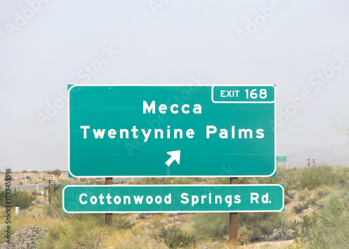 Mecca Twentynine Palms highway sing on the side of the 10 freeway in Southern California. Desert scrub brush in the background.Cottonwood Springs Road.