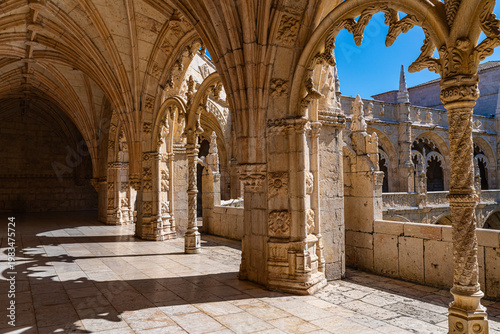 Photos Cloister of Jeronimos Monastery in Lisbon Portugal with ornate arches and histor