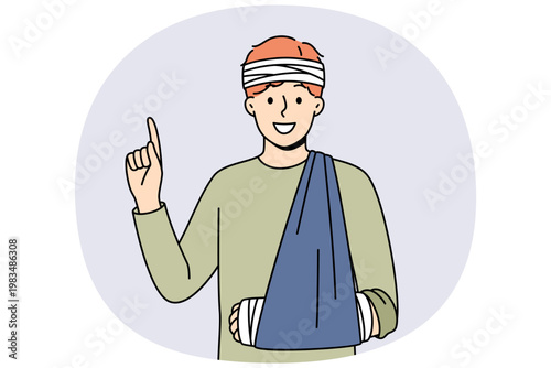 Injured man with bandaged head and hand pointing with finger up recommending getting health insurance. Happy young sick guy rejoices having medical insurance after fall or car accident