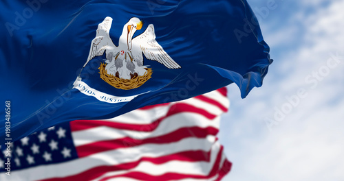 Louisiana state flag waving in the wind with the national flag of the United States