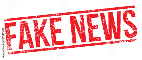 A close-up view of a red stamp reading Fake News on a white surface with bold letters.