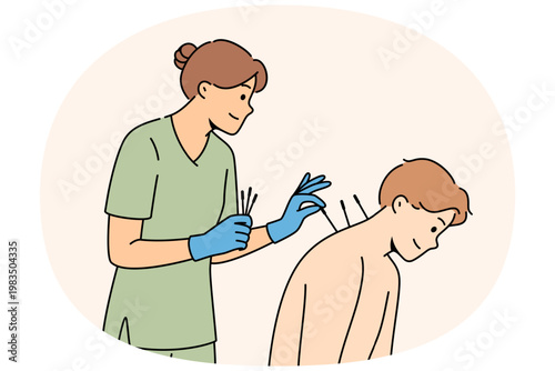Acupuncture procedure from eastern alternative medicine for man sitting near woman doctor. Girl gives acupuncture to patient to combat pain in spine or osteochondrosis causing poor posture.
