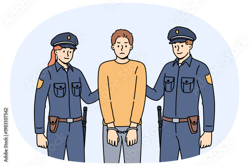 Two cops in police uniforms detained and handcuffed criminal for breaking law or disrespecting detectives. Brave cops fight crime to ensure safety of ordinary city residents who need protection