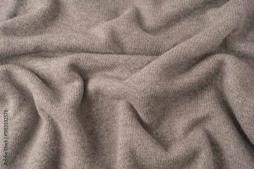 Soft grey merino wool sweater texture as a background.