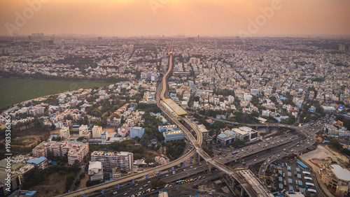 Fotografie Aerial view of Bangalore urban infrastructure featuring metro line, highways and