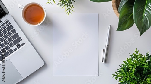 Top view office desk with empty sheet paper mockup laptop coffee cup and stationery