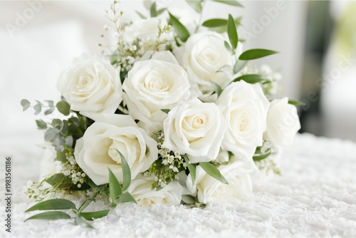 Beautiful White Rose Bouquet on a White Surface in a Bright Indoor Setting