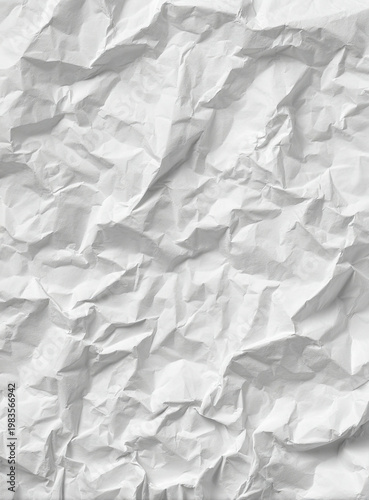 Close-up of crumpled white paper, showing detailed texture and shadows