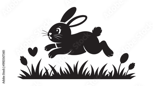 Black silhouette of a jumping bunny on grass rabbit